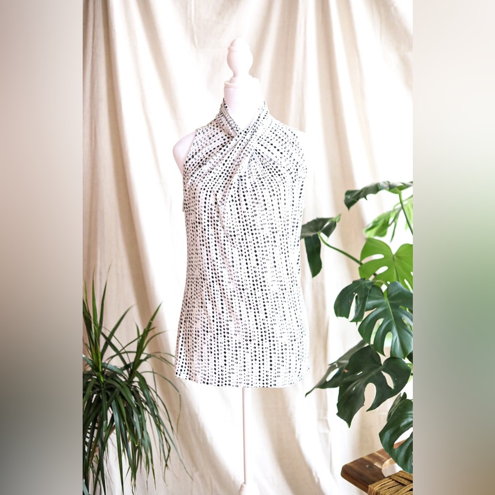 Sleeveless black and white blouse